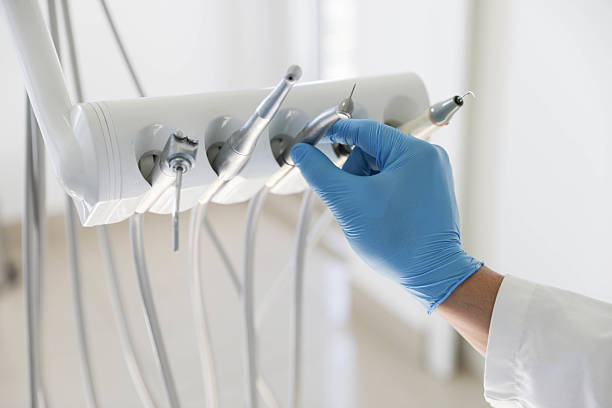 Professional Tooth Extraction technician working in Champaign County County, IL